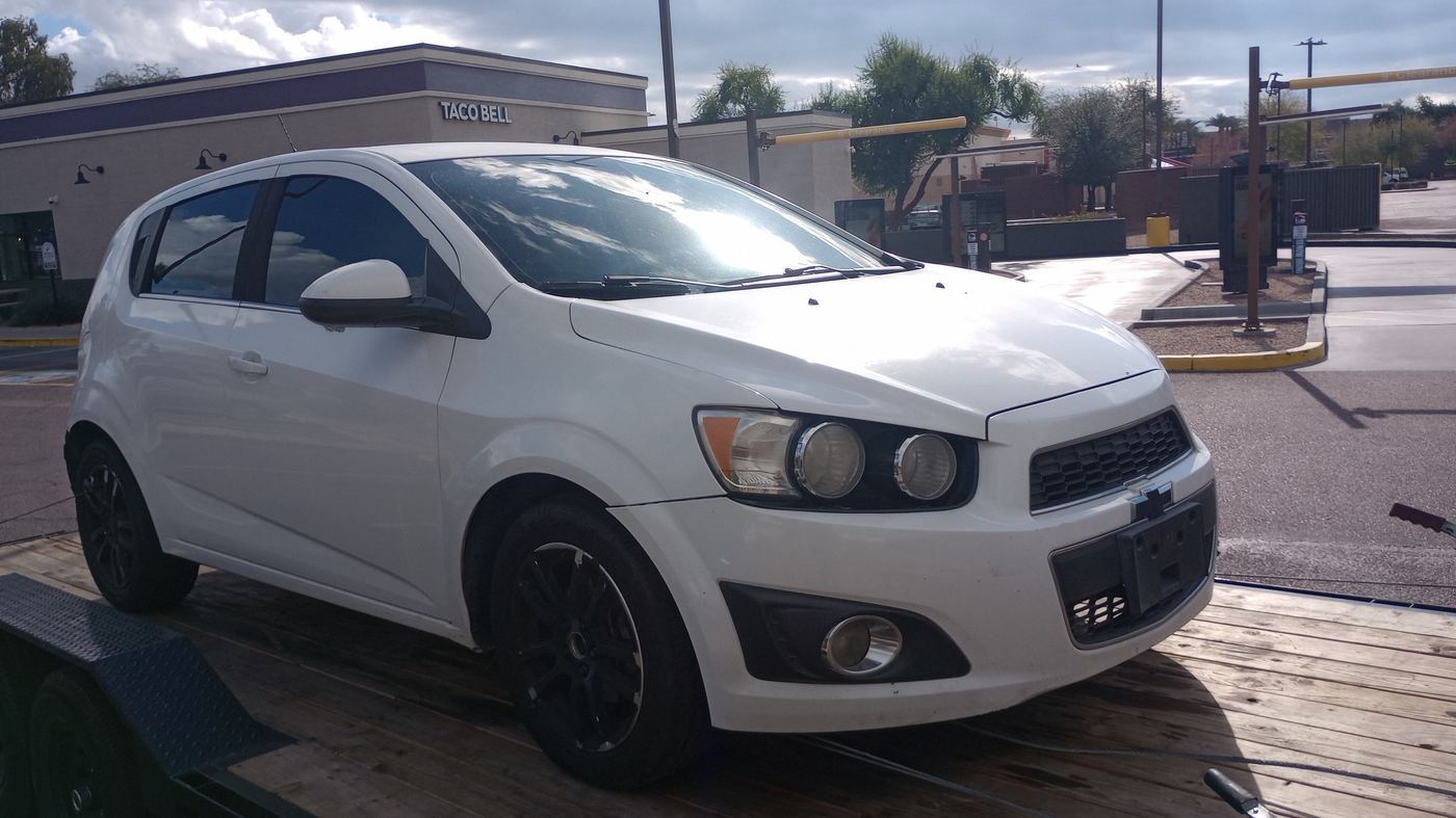 White Chevrolet Sonic bought for cash in Laveen Village, AZ